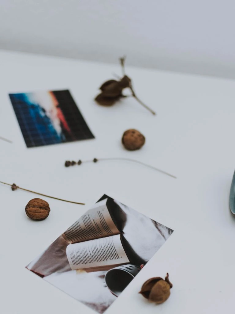 A stylist's working mood board with fabric swatches, paint chips, and a room photograph.