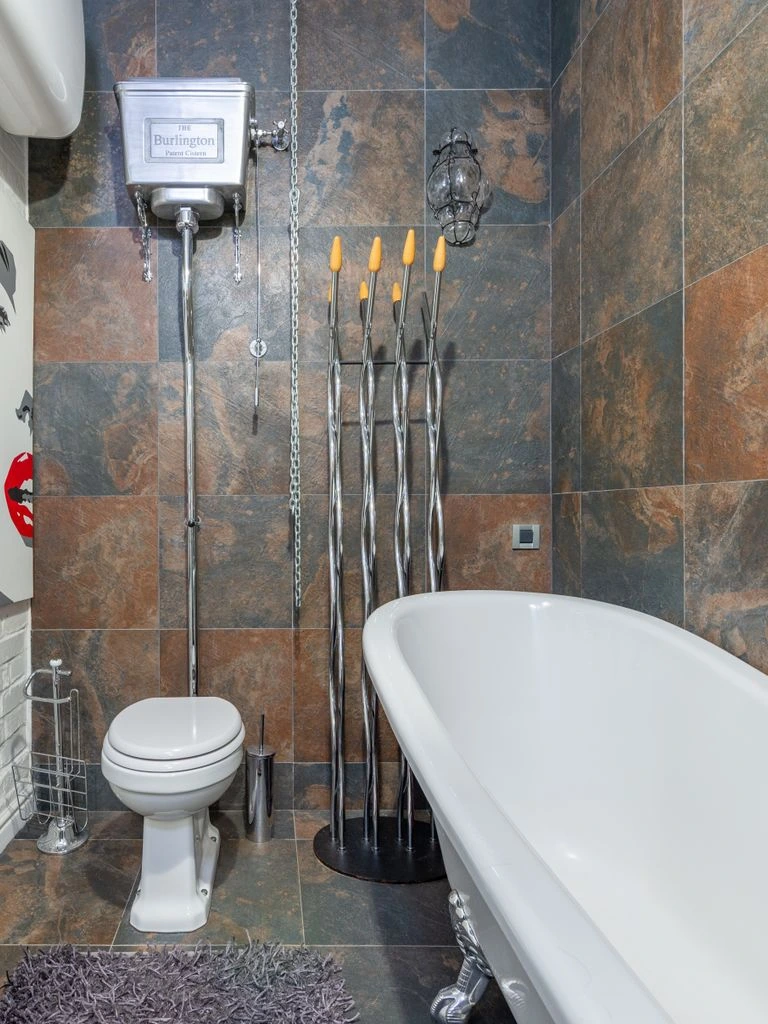 A small bathroom with a vintage freestanding tub.