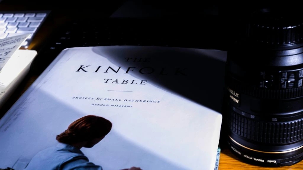 Styled reading table with design quarterlies at golden hour
